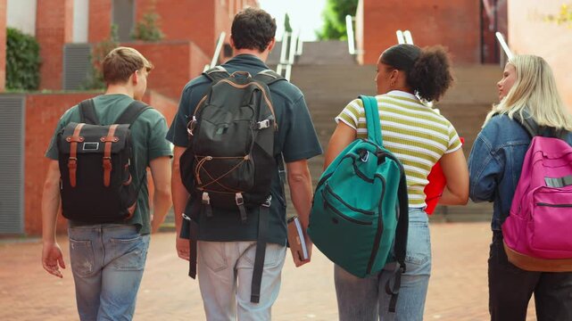 Diverse group of students walking on university campus
