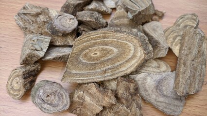 Dried slices of Derris scandens, traditional Thai herbal medicine ingredient, Close up of Thao Wan Priang herb for natural remedies