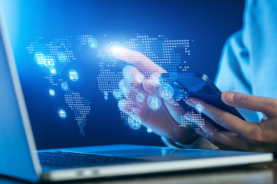 Digital technology connects people globally through smartphones and laptops in a modern workspace setting