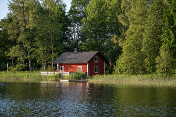 Red Swedish house by the lake