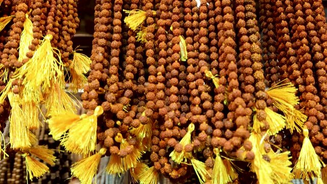 rudraksha mala garlands hanging in traditional retail market