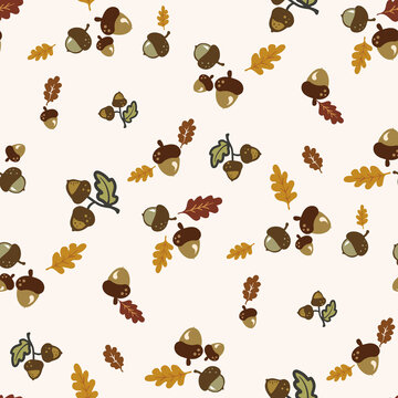 Seamless pattern with cute hand-drawn acorns and oak leaves, a fall season pastel background