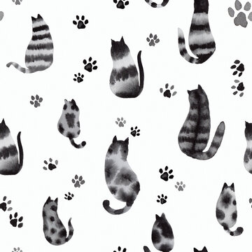 A seamless pattern with watercolor cats and paw prints in black and white, hand-painted spotted and tabby cats, sitting cats, view from behind
