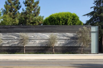 A contemporary design showcases a beautiful stone wall adorned with lush greenery, all set against the backdrop of a bustling city street during the day
