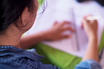 Close Up of Hand Taking Notes on Notebook