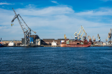 Fototapeta premium Saint Petersburg shipyard industrial port cranes loading cargo