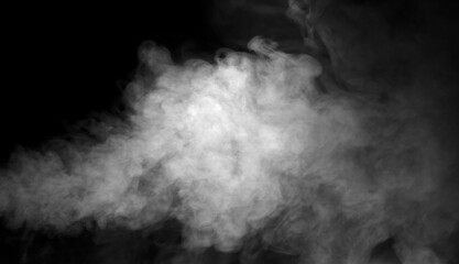 Fototapeta premium Dense white smoke drifting on a dark background creates a dramatic atmospheric texture, ideal for design overlays, cinematic effects, and creative compositions needing mist, fog, or vapor elements.
