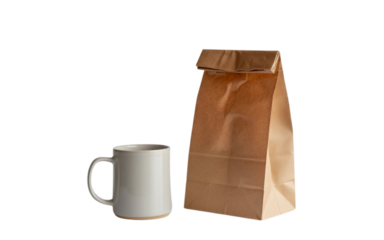 White coffee mug and brown paper lunch bag isolated on transparent background