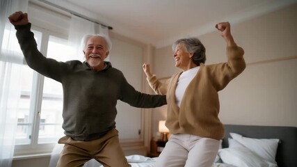 Elderly couple jumping together on a bed or trampoline, laughter on their faces, sunlight streaming through a nearby window — concept of playful joy, carefree love, active aging, and senior