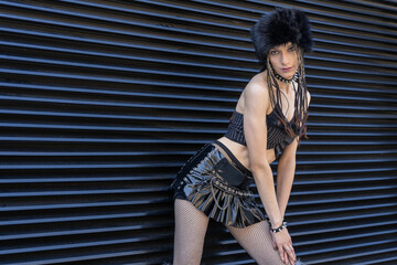 Young woman adopting alternative fashion style, posing