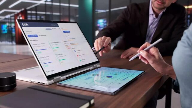 Financial Analyst Using OKR Dashboard To Track Company Goals
