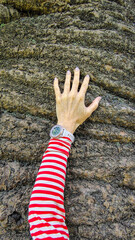 Woman hugging a large tree trunk