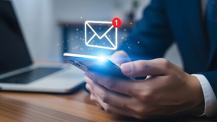 Man checking email on smartphone with notification icon