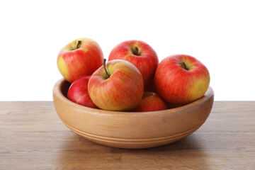 Ripe red apples in bowl on wooden table against white background, closeup