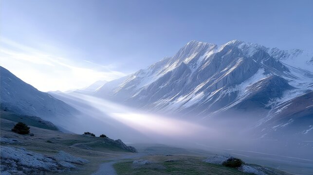 Snowy Mountains with Fog in a Valley Landscape