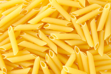 Pasta Penne texture background. Pasta is a staple food of traditional Italian cuisine