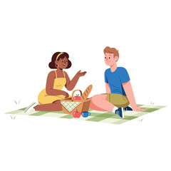 Young african female and caucasian male enjoying outdoor picnic on blanket