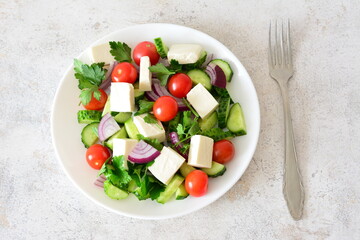 a plate of Fresh Salad with Feta, cherry mini Tomatoes and Cucumber still life