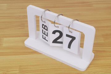 February, 27 on calendar on wooden table
