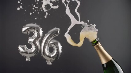 Number 36 balloon with popping champagne bottle. Celebrating a milestone, anniversary or birthday