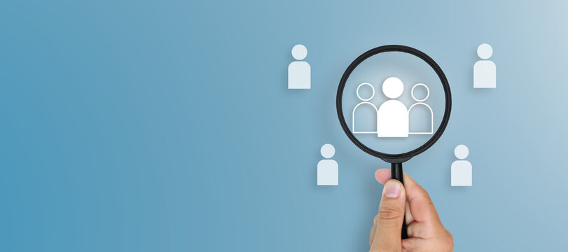 Magnifying glass icon focusing on selected candidates representing recruitment, human resources analytics, talent search, employee selection and modern HR technology on blue background.