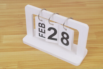 February, 28 on calendar on wooden table