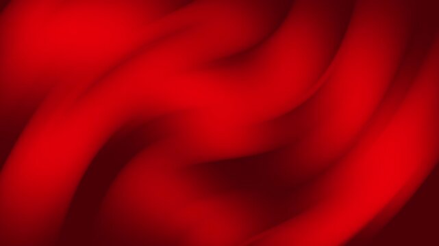 Elegant flowing red satin fabric creating a smooth and sensual abstract pattern for a luxurious background