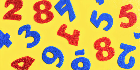 Numeri realizzati in colori rossi e blu brillanti e scintillanti su una superficie gialla