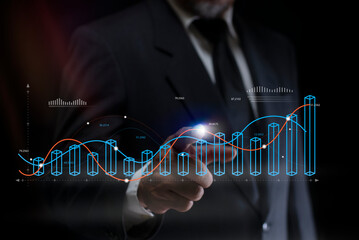 Businessman hand touching business charts on a touch screen. Data analysis. Financial data on a monitor as Finance data concept. Analytics
