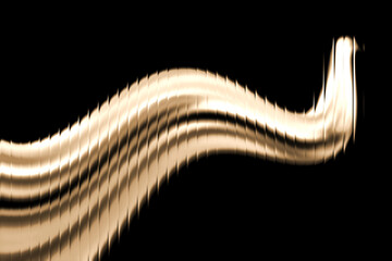 Elegant gold ribbon flowing across a stark black canvas creating a luxury backdrop for product marketing and showcasing sophisticated design elements