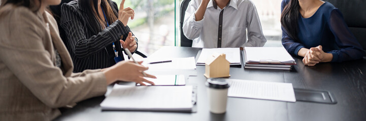 Obraz na płótnie Canvas Business people signing contract making deal with real estate agent Concept for consultant home insurance Real estate investment Property insurance security. Real estate agent.