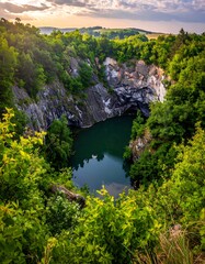 Fototapeta premium Scenic quarry lake at sunrise