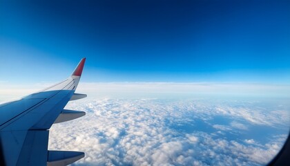 airplane window view of clear blue sky and clouds travel background with copy space