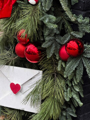 Festive Christmas Decor with Red Ornaments and Heart Envelope