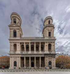 Fototapeta premium Paris, France - 11 15 2025: Saint-Germain-des-Pres district. View outside Saint-Sulpice Church facade and the fountain