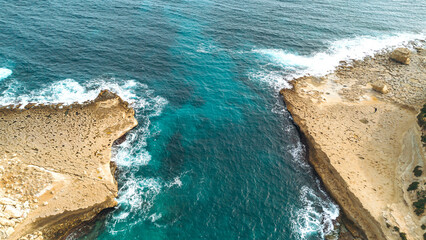 Aerial view of rocky coastline and turquoise sea. Travel destination.