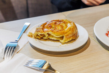 Flaky Savory Pastry on a White Plate