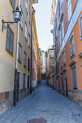 Steep, narrow, and quiet cobblestone alley in a historic European city center