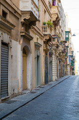 Fototapeta premium Valletta Streetscape: Balconies and Stone