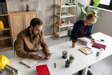 Colleagues collaborating in coworking office space