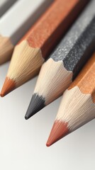 Obraz premium Close-up of colored pencils on a white surface.