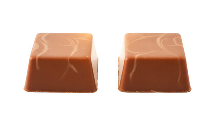 Two square milk chocolate candies isolated PNG, delicious dessert with caramel swirl on top for confectionery and sweet treat concepts