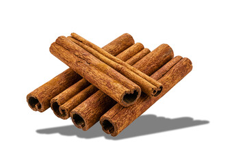 Stacked aromatic cinnamon quills on a deep, dark field