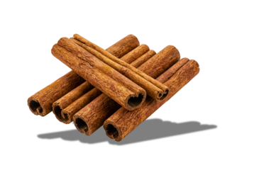 Stacked aromatic cinnamon quills on a deep, dark field