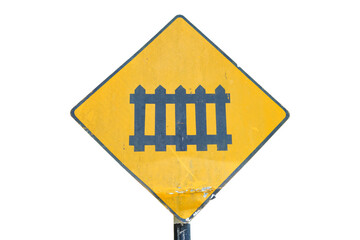 Railroad crossing warning sign with steam locomotive icon and weathered surface