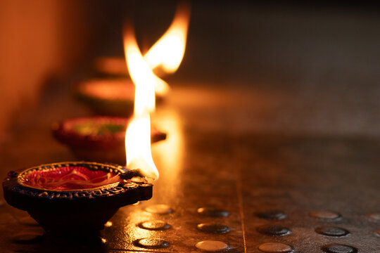 Portrait view of Karthigai deepam colorful oil lamp, a bright lights in the night - Powered by Adobe