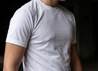 Men's s-ports T-shirt mockup, upper body, in an abandoned location