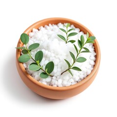Spa sea salt in bowl with green leaves for aromatherapy and wellness treatment on white background close up