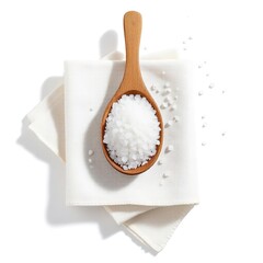 Sea salt in wooden spoon on white cloth still life cooking ingredient food photography closeup salt crystals