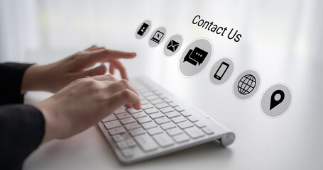 A close-up view of hands typing on a keyboard, enhanced by various contact icons floating above. This image symbolizes the importance of digital communication for customer engagement. Gantry